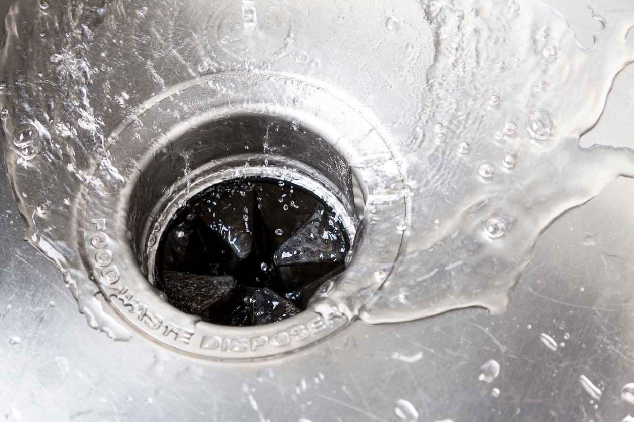Stainless steel kitchen sink with garbage disposal