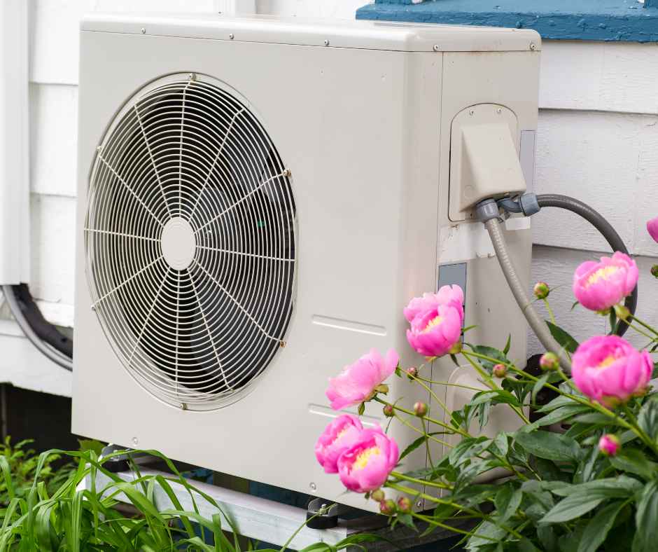 A heat pump unit on the outside of a home